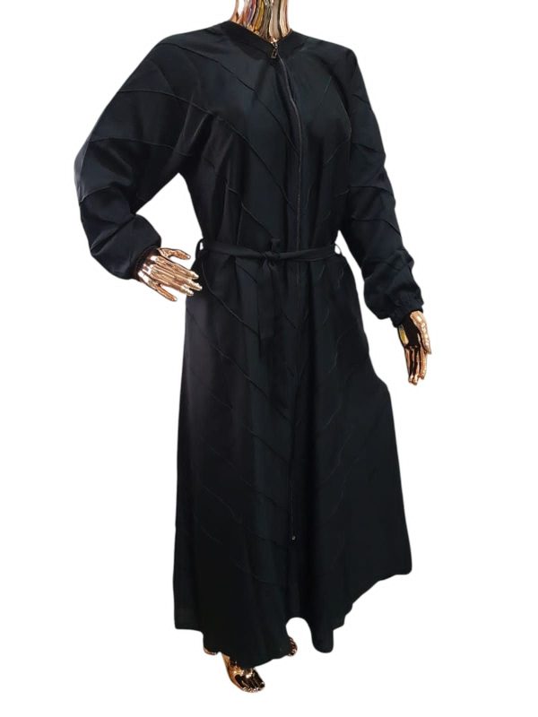 BLACK CLOAK WITH STITCHED LINES.